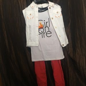 White jean vest, girl on fire shirt, red jeggings